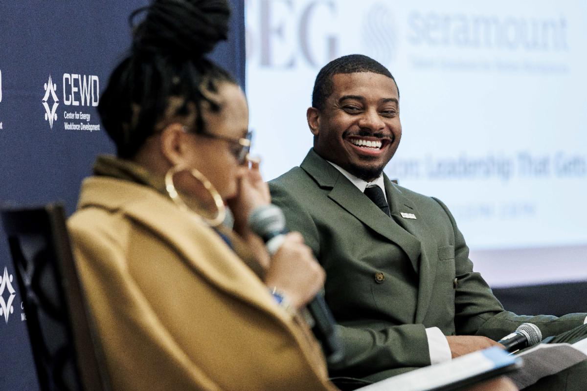 two smiling presenters at the 2025 cewd forum