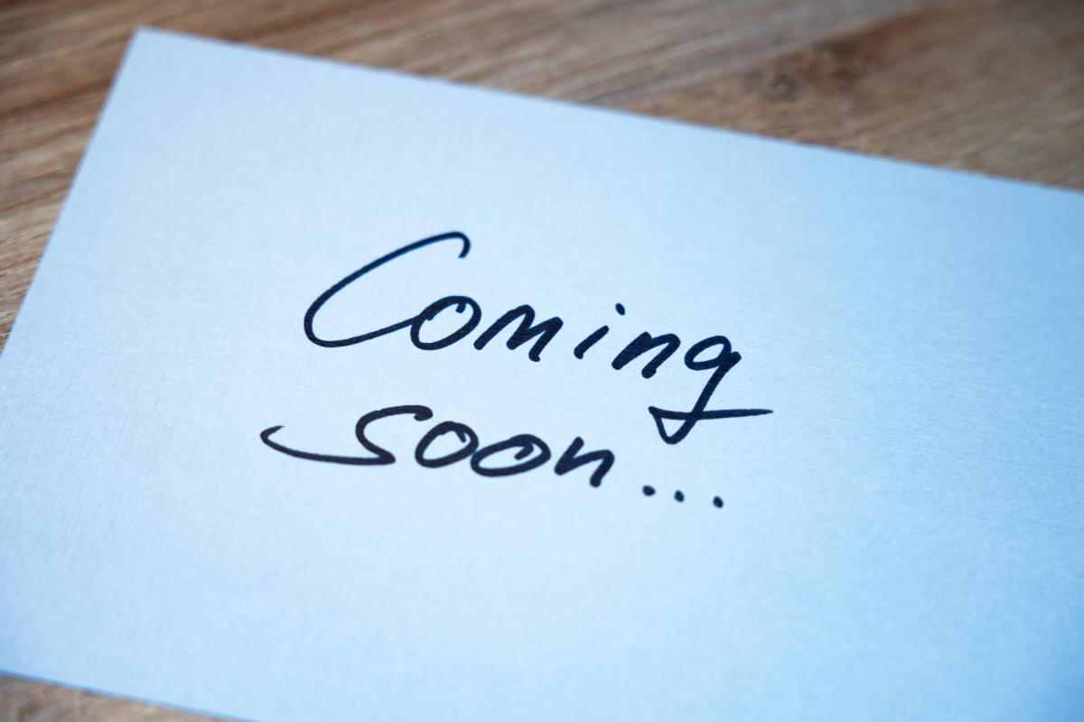 coming soon written on a piece of paper